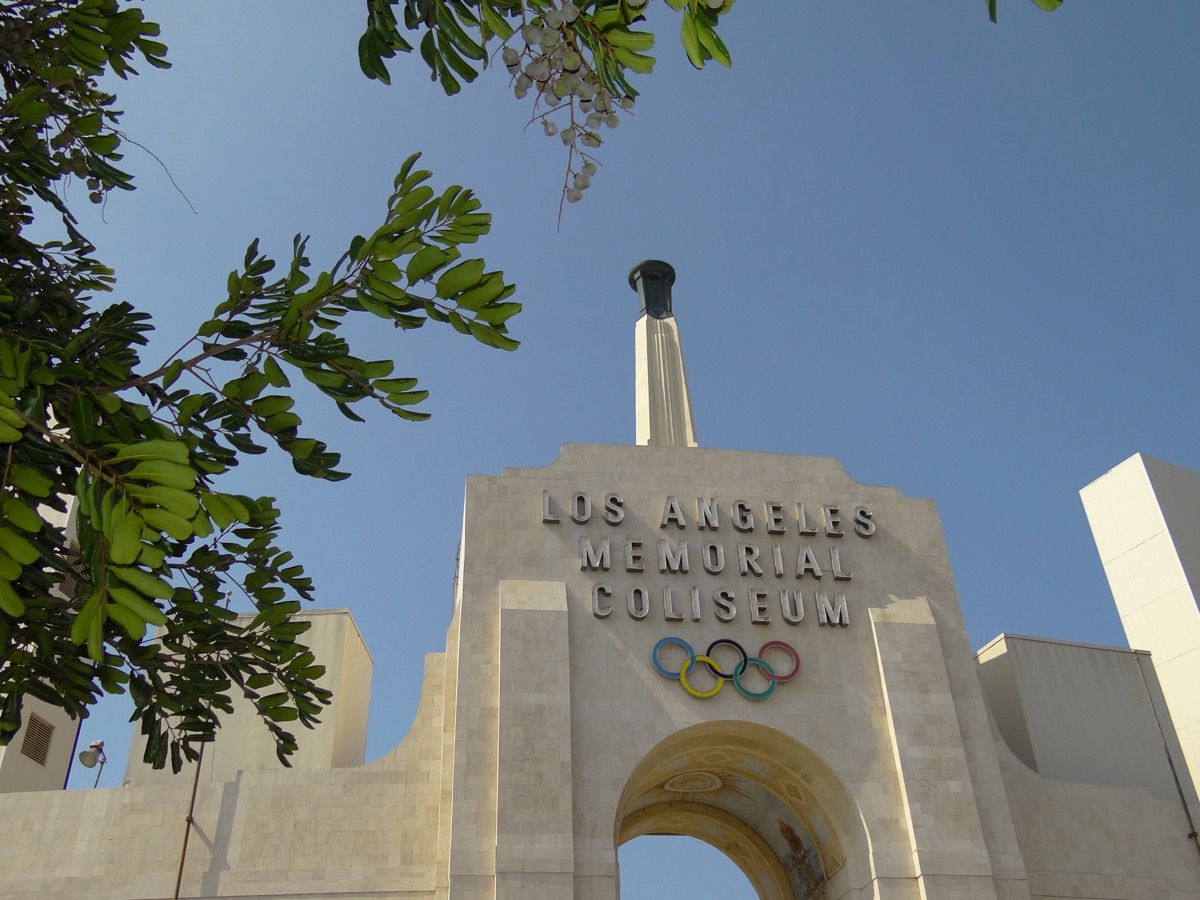 The entrance and Olympic rings at the Los Angeles Memorial Coliseum
